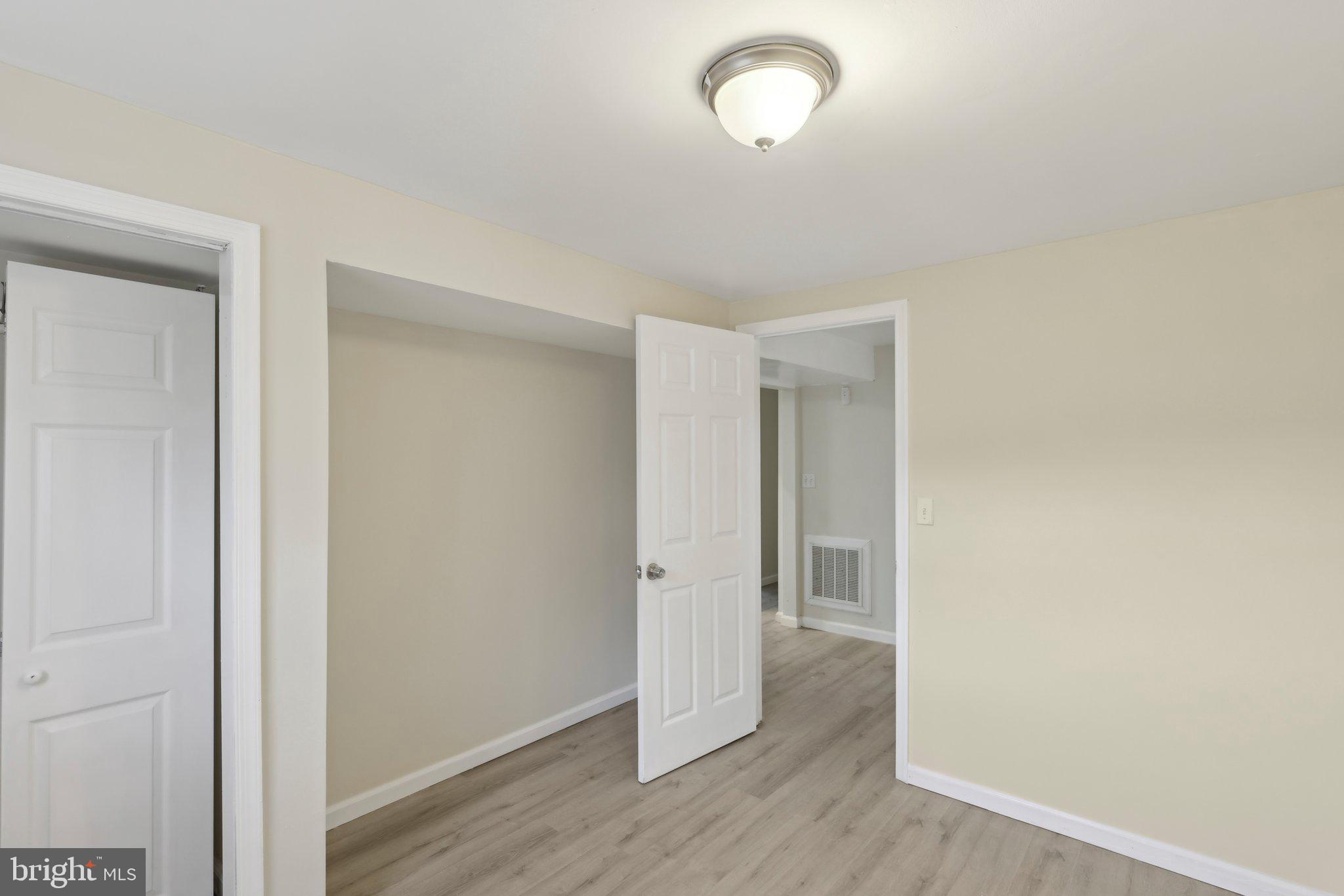 117 Susan Drive Jackson, NJ 08527 - Photo 16 of 43 a view of an empty room with wooden floor