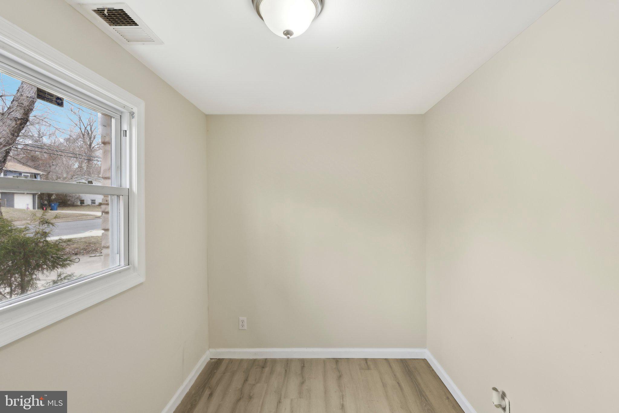 117 Susan Drive Jackson, NJ 08527 - Photo 17 of 43 a view of a small space with wooden floor and a window