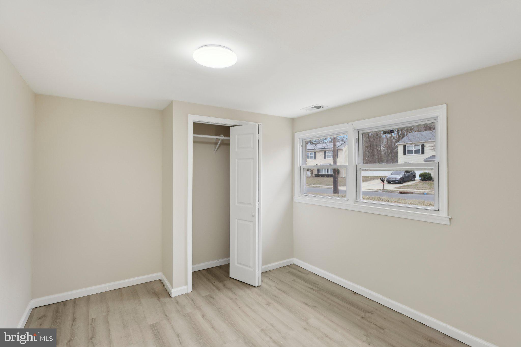 117 Susan Drive Jackson, NJ 08527 - Photo 19 of 43 a view of an empty room with closet and a window