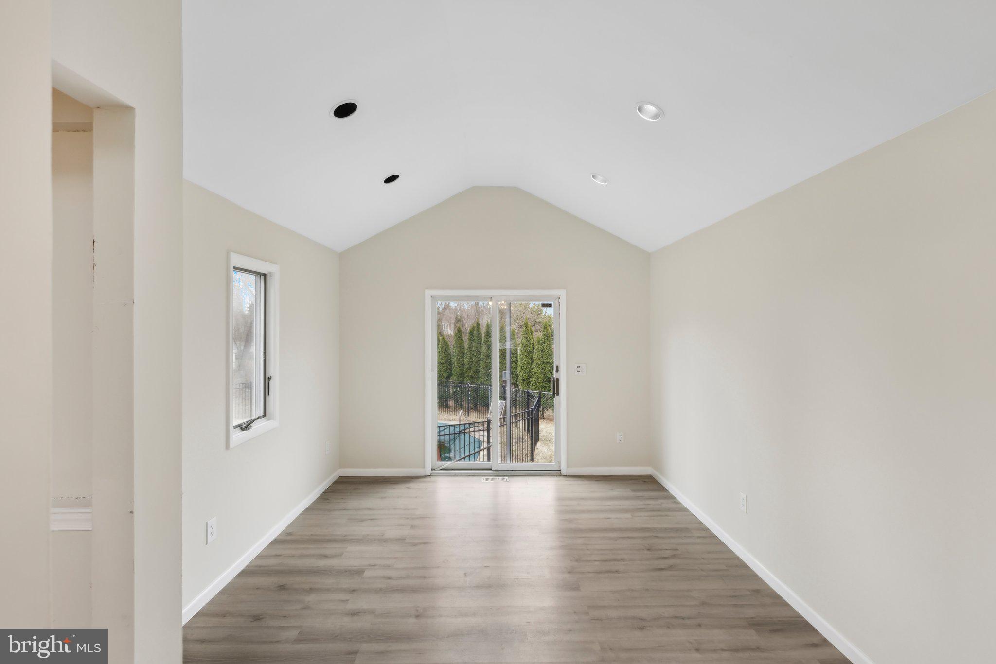 117 Susan Drive Jackson, NJ 08527 - Photo 21 of 43 a view of an empty room with wooden floor and a window