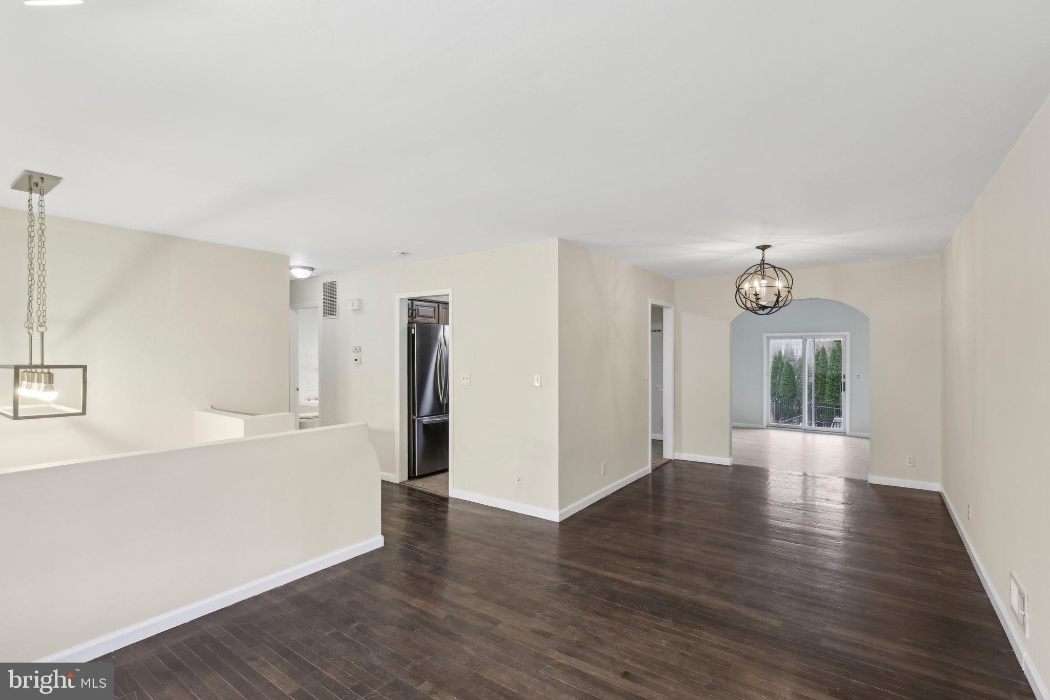 117 Susan Drive Jackson, NJ 08527 - Photo 25 of 43 a view of a big room with wooden floor and windows