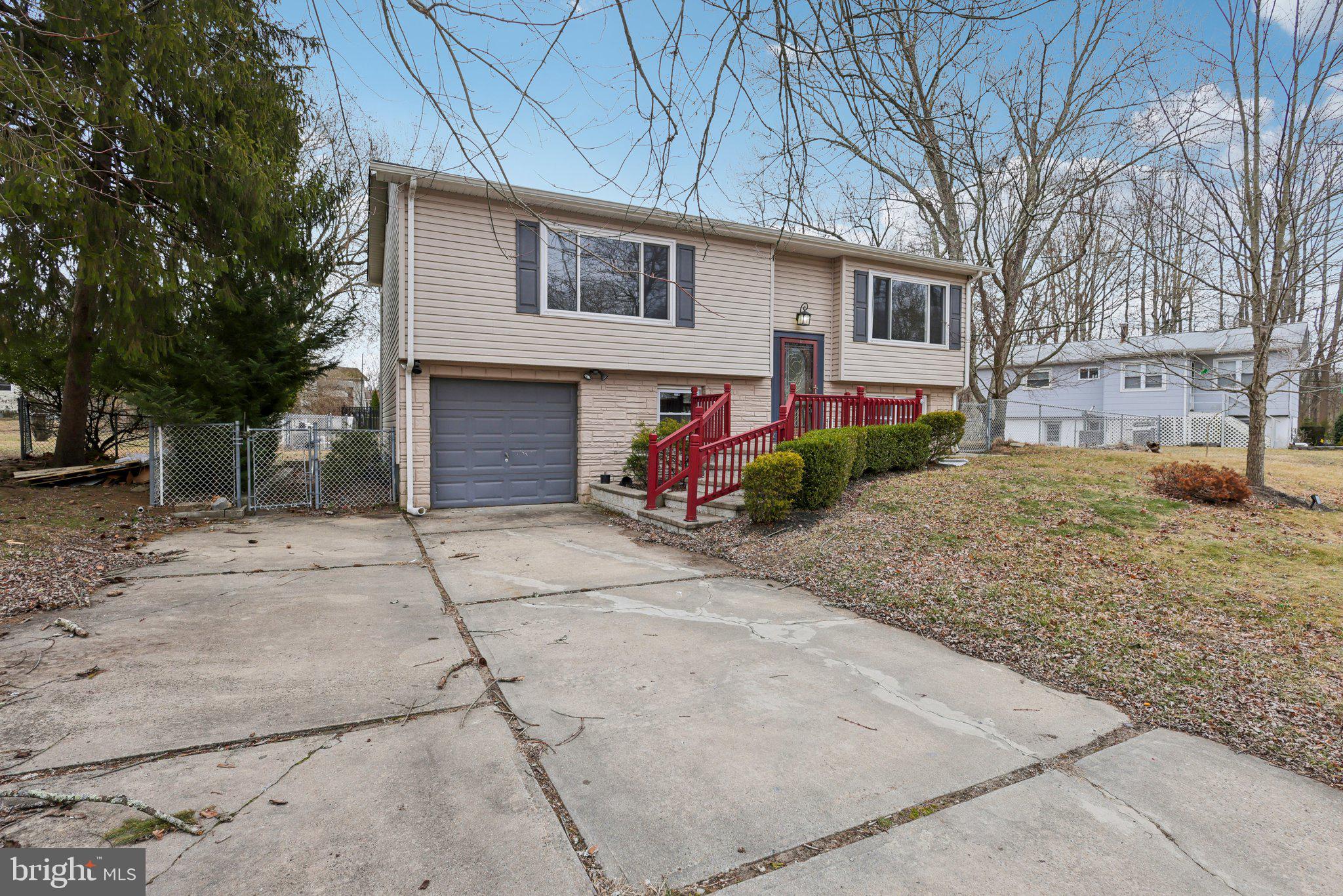 117 Susan Drive Jackson, NJ 08527 - Photo 3 of 43 a front view of a house with garden