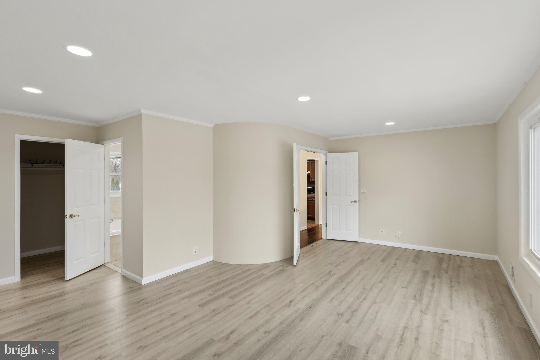 117 Susan Drive Jackson, NJ 08527 - Photo 6 of 43 a view of an empty room with wooden floor and closet