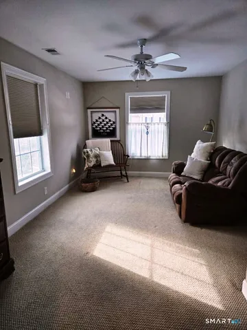 a bedroom with bed and window