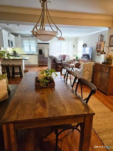 a dining room with furniture and window