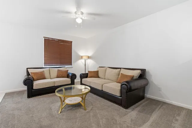 a bedroom with furniture and a couch