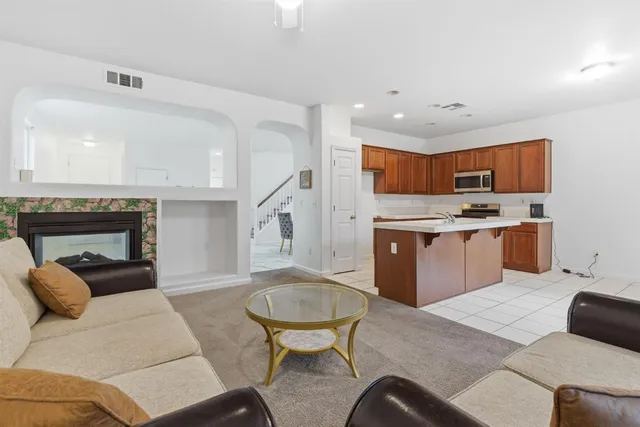 a living room with furniture and a fireplace