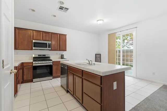 a kitchen with a stove and a microwave