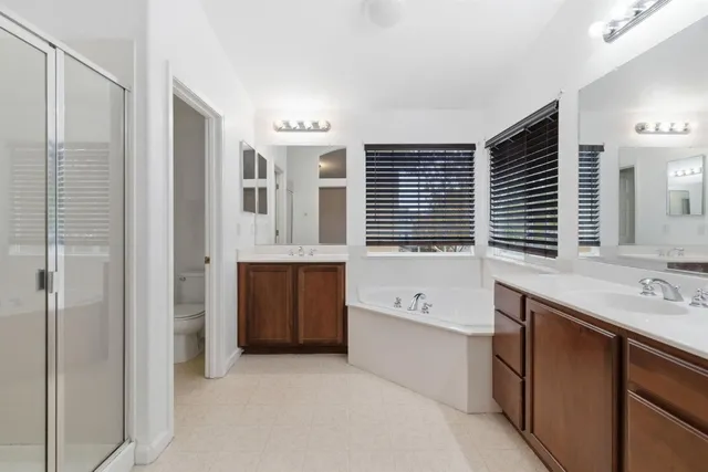 a bathroom with a glass shower door