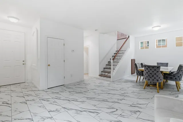 a view of empty room with a fireplace