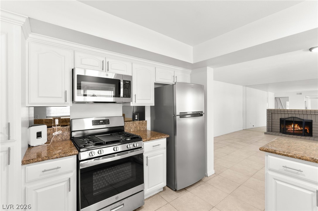 4430 Cranbrook Way Las Vegas, NV 89103 - Photo 15 of 50 Culinary dreams come alive in this kitchen, featuring gleaming stainless steel appliances and durable granite counters.