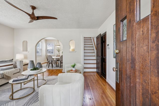 a view of a dining room with furniture and window