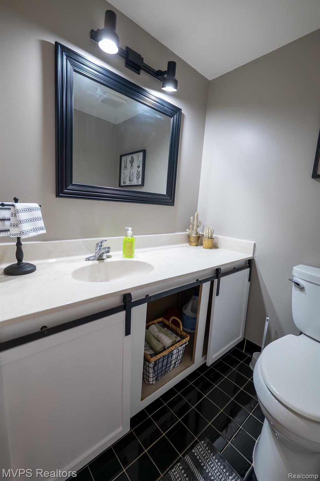 804 Oak Brook Ridge Drive, Unit 149 Rochester, MI 48307 - Photo 15 of 49 Vanity with white countertop, integrated sink, and track lighting