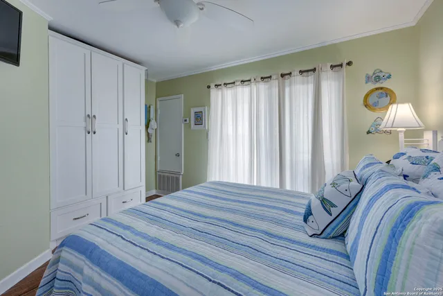 a bedroom with a bed and a closet