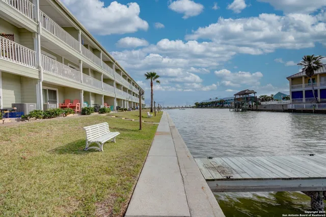 a view of a swimming pool with a lounge chair
