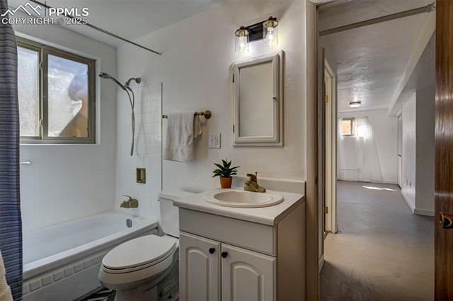 4665 Fox Road Cascade, CO 80809 - Photo 43 of 50 Garden Level Basement Bathroom with vanity, framed mirror/medicine cabinet and tub/shower.