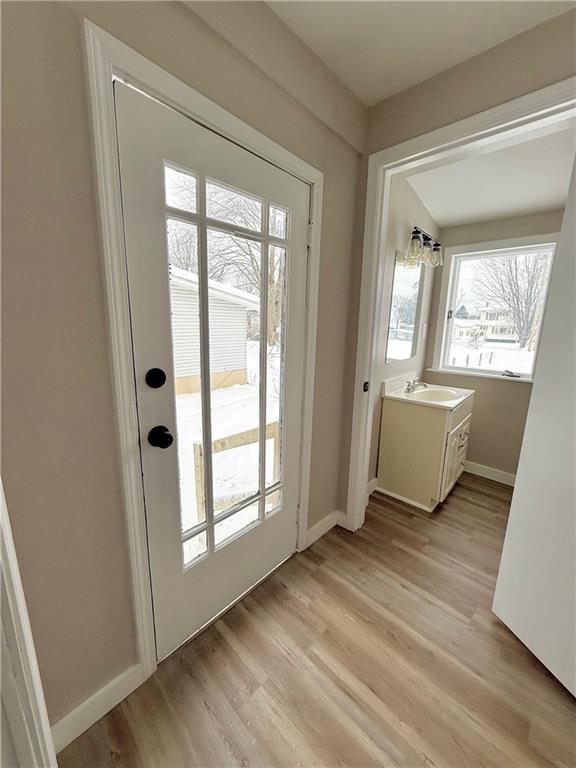 570 High Street Conneaut Lake, PA 16316 - Photo 11 of 26 an empty room with wooden floor and windows