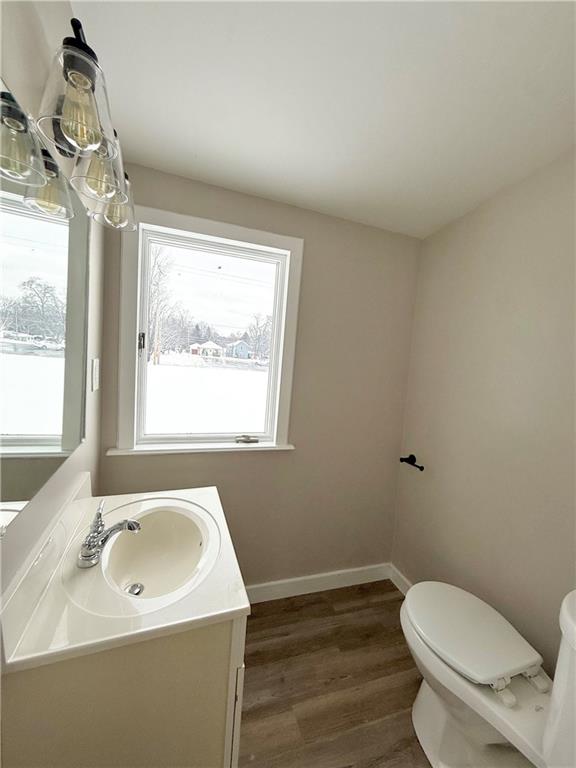 570 High Street Conneaut Lake, PA 16316 - Photo 13 of 26 a bathroom with a sink a toilet and a mirror