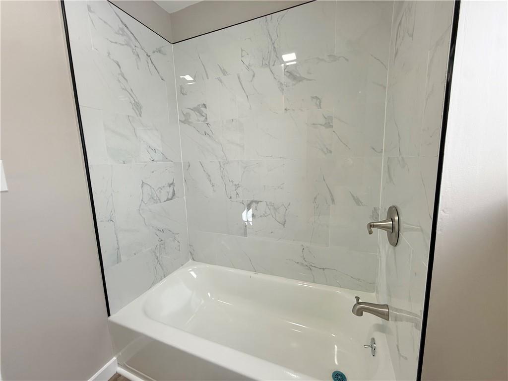 570 High Street Conneaut Lake, PA 16316 - Photo 18 of 26 a bathroom with a bathtub