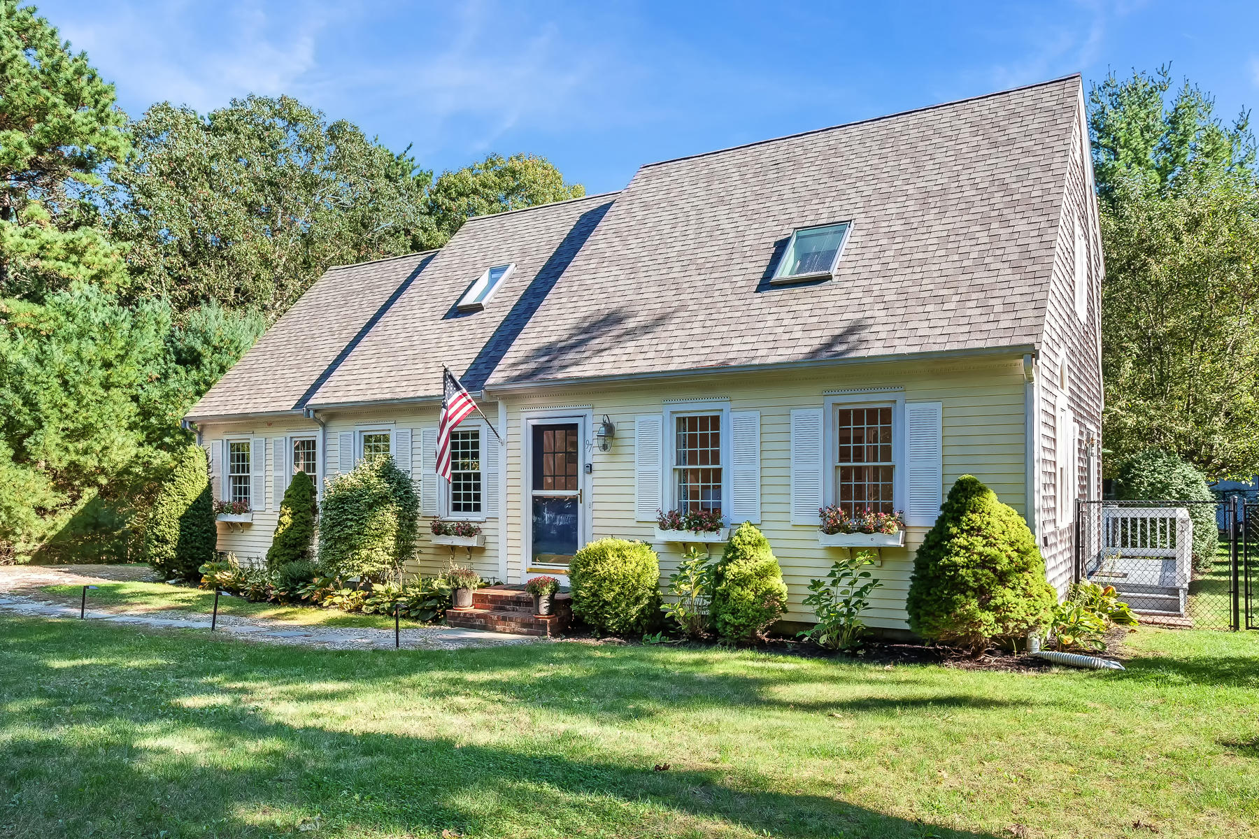97 Shields Road Mashpee, MA 02649 - Photo 1 of 31 a view of a house with a yard and potted plants