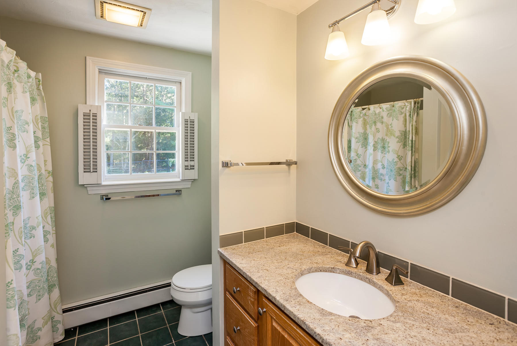 97 Shields Road Mashpee, MA 02649 - Photo 17 of 31 a bathroom with a granite countertop toilet a sink and a mirror