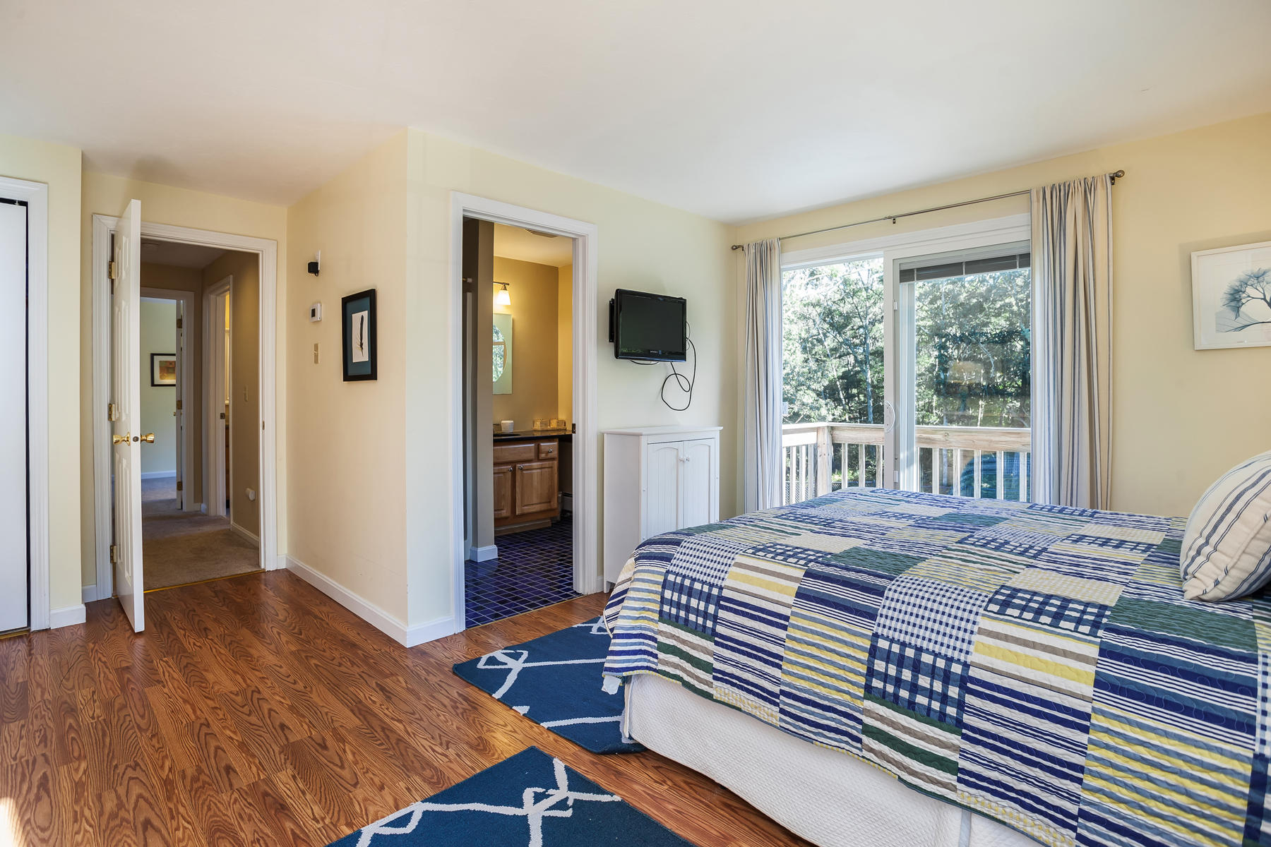 97 Shields Road Mashpee, MA 02649 - Photo 19 of 31 a bedroom with a bed and a large window