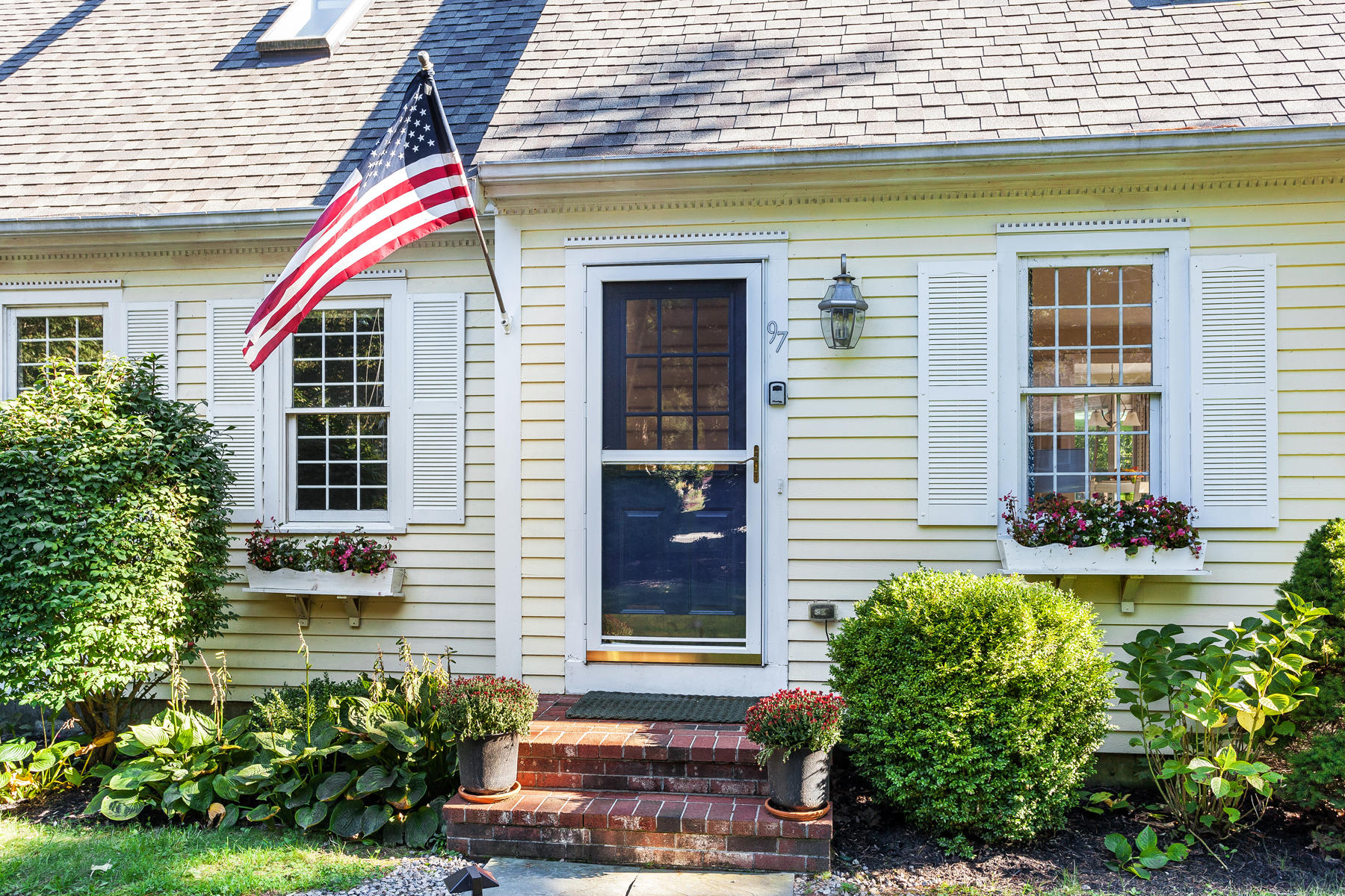 97 Shields Road Mashpee, MA 02649 - Photo 3 of 31 a front view of a house with garden