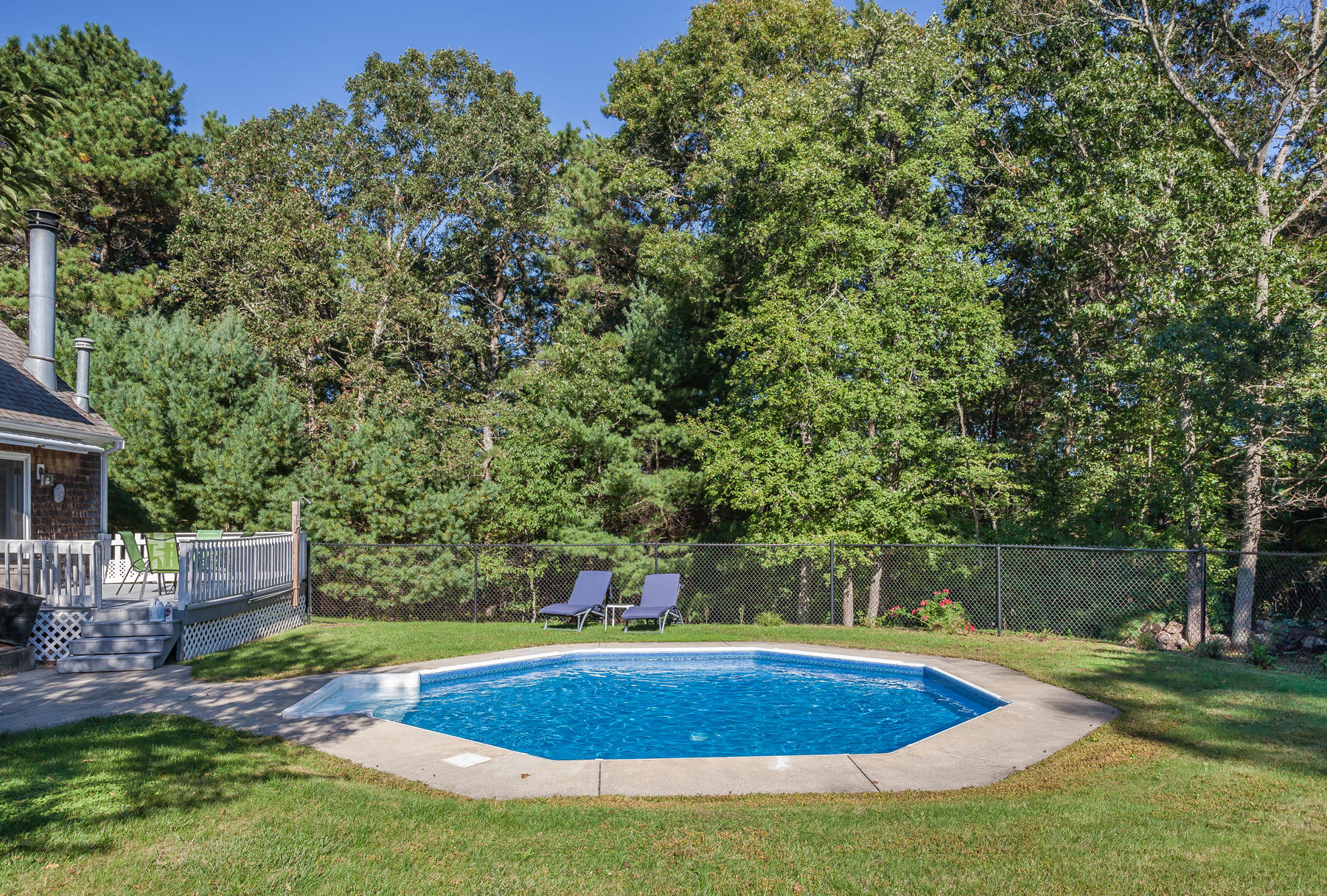97 Shields Road Mashpee, MA 02649 - Photo 31 of 31 a view of a backyard with swimming pool