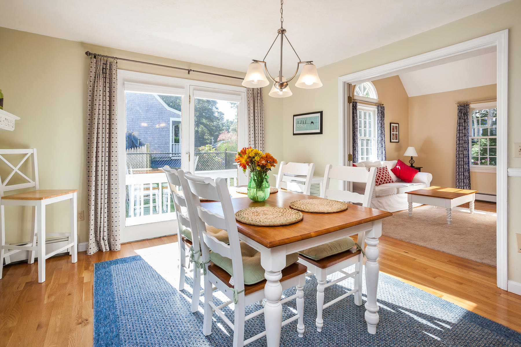 97 Shields Road Mashpee, MA 02649 - Photo 8 of 31 a view of a dining room with furniture a chandelier and wooden floor