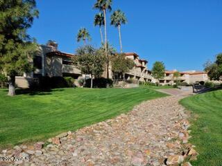10410 North Cave Creek Road, Unit 2043 Phoenix, AZ 85020 - Photo 12 of 22 a front view of a house with garden