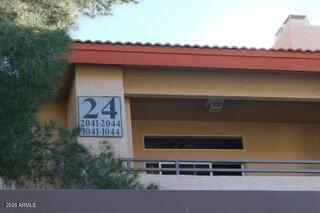 10410 North Cave Creek Road, Unit 2043 Phoenix, AZ 85020 - Photo 18 of 22 a small place with wooden bench in front of it