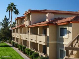 10410 North Cave Creek Road, Unit 2043 Phoenix, AZ 85020 - Photo 4 of 22 a view of a house with a yard