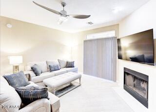 10410 North Cave Creek Road, Unit 2043 Phoenix, AZ 85020 - Photo 8 of 22 a living room with furniture and a flat screen tv