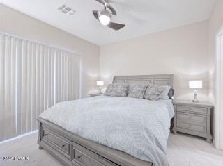 10410 North Cave Creek Road, Unit 2043 Phoenix, AZ 85020 - Photo 9 of 22 a bedroom with a bed and a dresser
