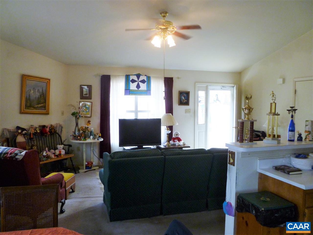25 Poppy Road Ruckersville, VA 22968 - Photo 11 of 32 a living room with furniture and a flat screen tv