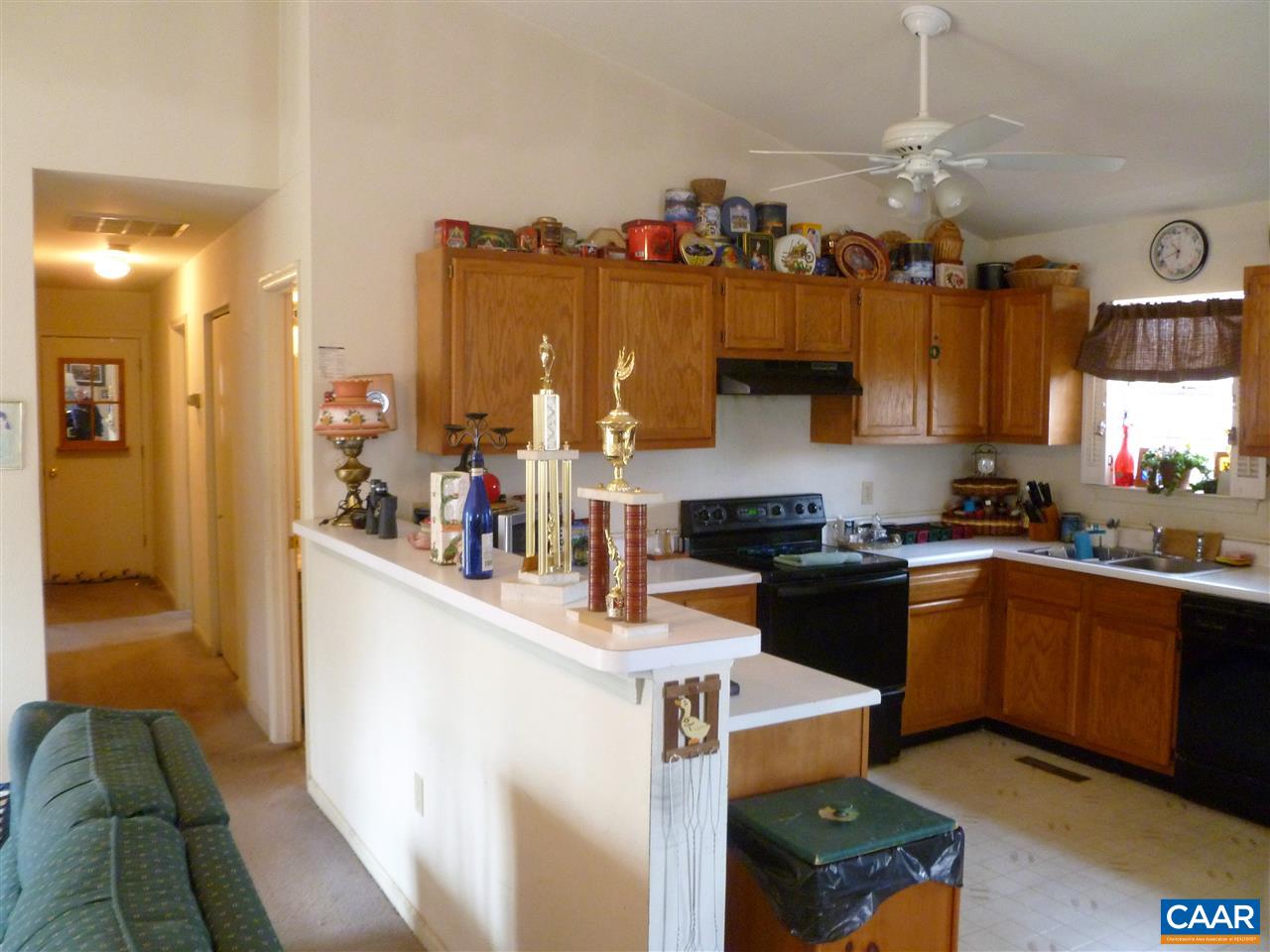25 Poppy Road Ruckersville, VA 22968 - Photo 12 of 32 a kitchen with granite countertop a sink stove and cabinets