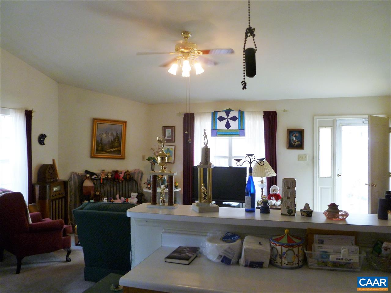 25 Poppy Road Ruckersville, VA 22968 - Photo 14 of 32 a living room with furniture and a flat screen tv