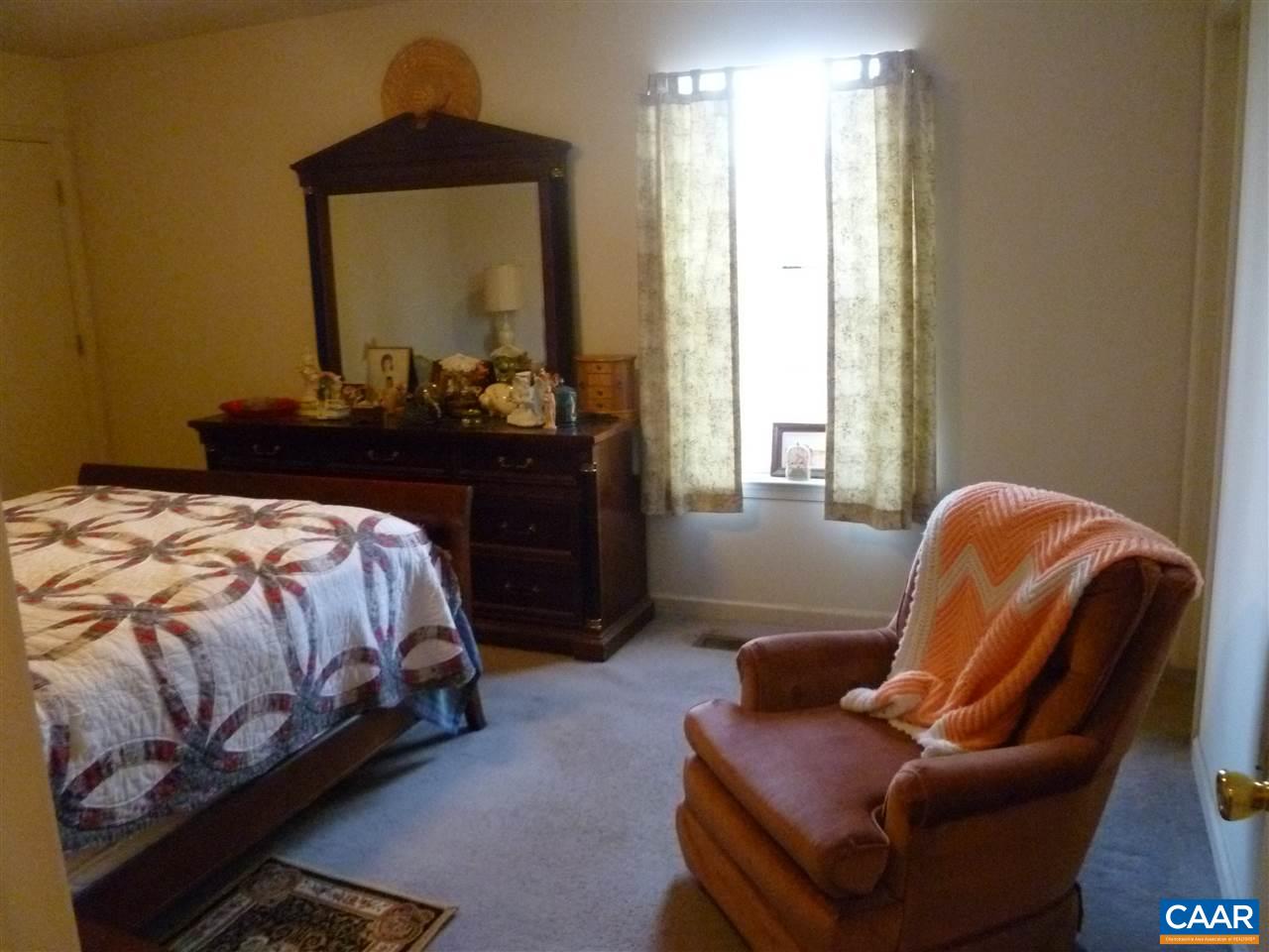 25 Poppy Road Ruckersville, VA 22968 - Photo 16 of 32 a bed room with a bed and a chair