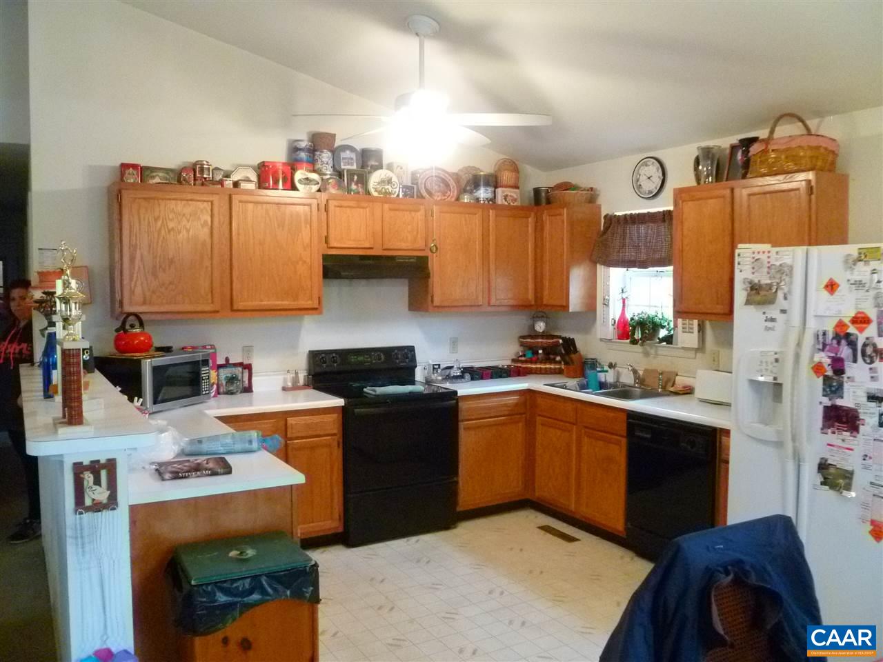 25 Poppy Road Ruckersville, VA 22968 - Photo 4 of 32 a kitchen with granite countertop a sink appliances and cabinets