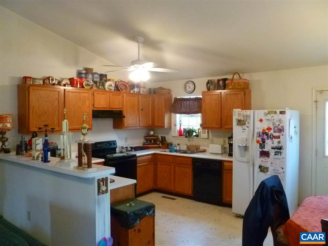 25 Poppy Road Ruckersville, VA 22968 - Photo 5 of 32 a kitchen with refrigerator and cabinets