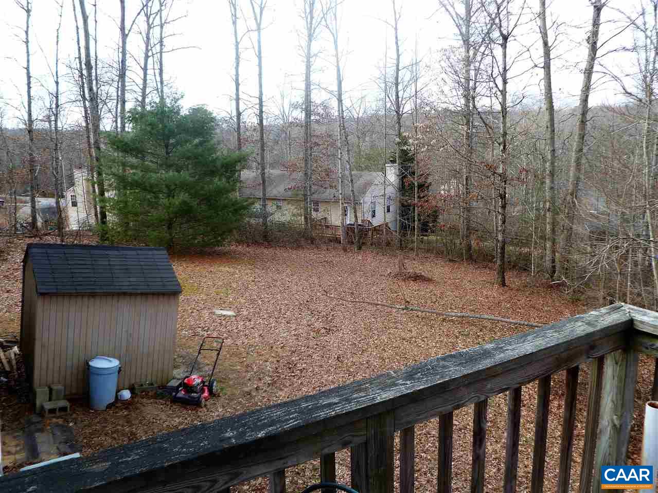 25 Poppy Road Ruckersville, VA 22968 - Photo 7 of 32 a view of a backyard with trees