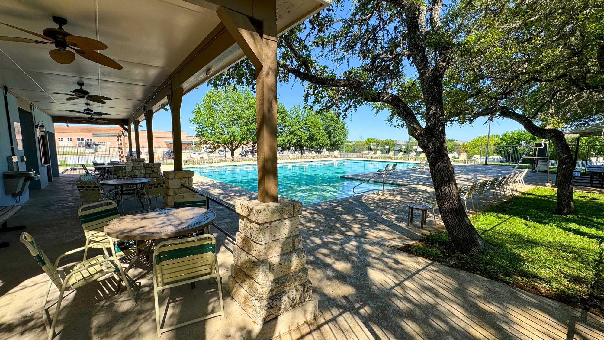 5881 Fergus Kyle, TX 78640 - Photo 39 of 40 One of the community pool areas. Mature trees shade a spacious poolside patio area under a covered pavilion.