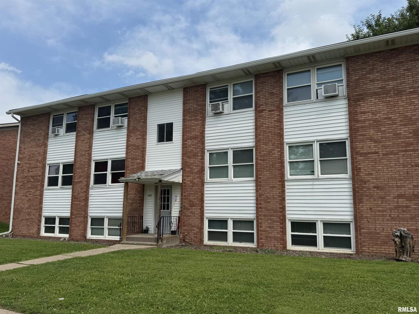 1907 16th Street Silvis, IL 61282 - Photo 1 of 10 a front view of a house with a yard