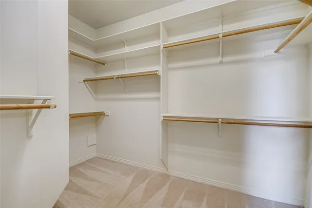 a view of an empty walk in closet