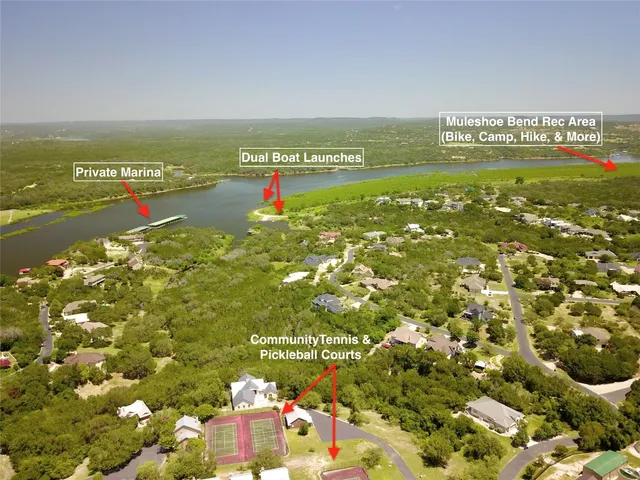 an aerial view of residential houses with outdoor space