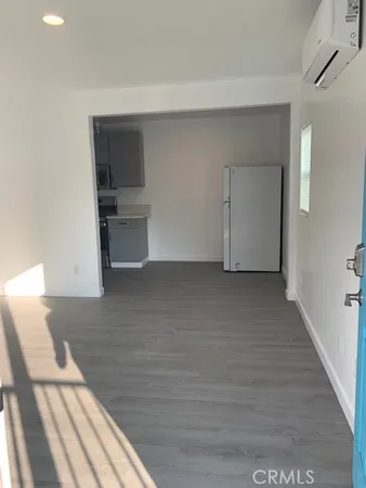 a kitchen with a sink a stove and cabinets
