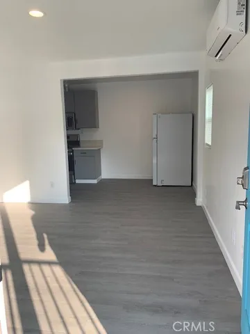 a kitchen with a sink a stove and cabinets