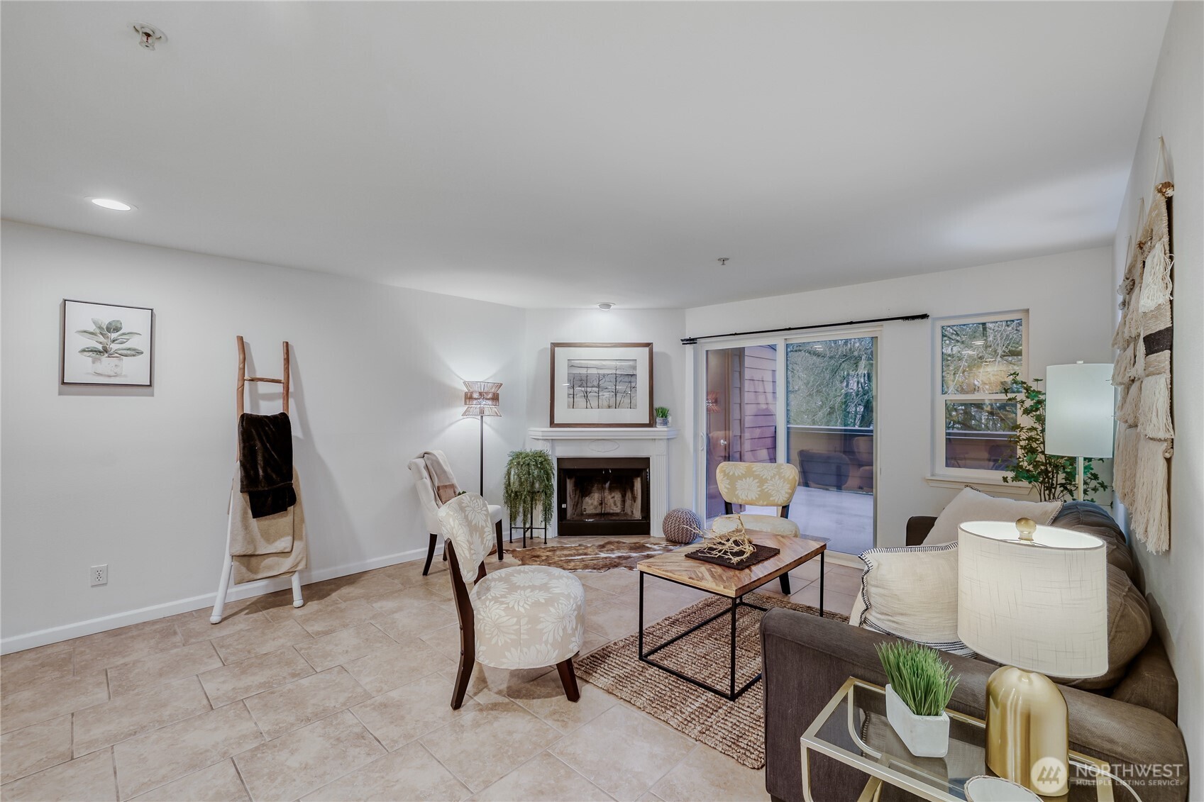 15805 Waynita Way Northeast, Unit D107 Bothell, WA 98011 - Photo 3 of 18 a living room with furniture a fireplace and a flat screen tv