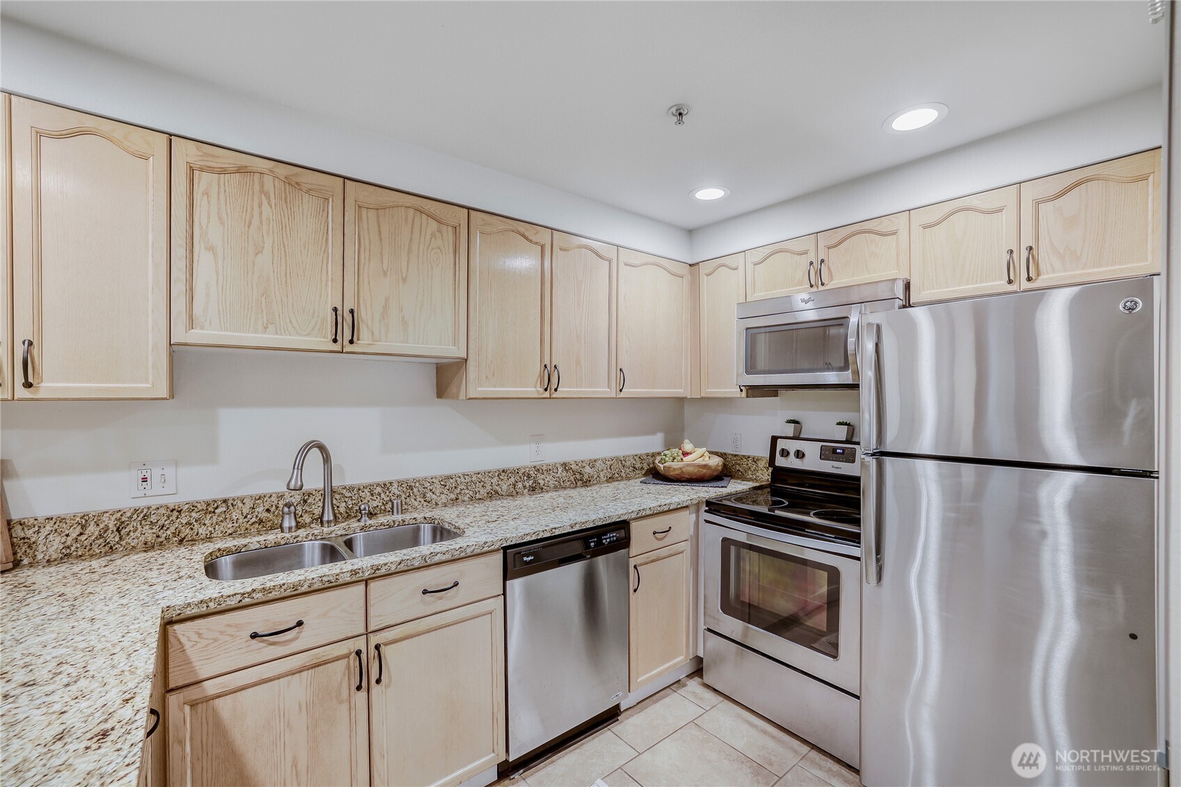 15805 Waynita Way Northeast, Unit D107 Bothell, WA 98011 - Photo 7 of 18 a kitchen with granite countertop cabinets and steel stainless steel appliances