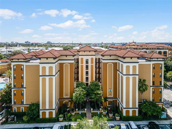 a front view of a residential apartment building with a yard